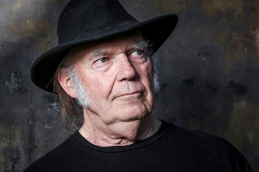 FILE - In this May 18, 2016, file photo, Neil Young poses for a portrait in Calabasas, Calif., to promote his new album, "Earth." Young penned an open letter on Facebook posted on Monday, Nov. 28, 2016, in which he calls for President Barack Obama “to step in and end” what he calls the “violence” against protesters demonstrating against an oil pipeline being built on part of an Indian reservation in North Dakota. (Photo by Rich Fury/Invision/AP, File)