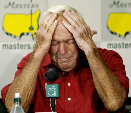 FILE - In this April 9, 2004, file photo, Arnold Palmer reacting during his press conference after playing his final round of Masters competition at the 2004 Masters golf tournament at the Augusta National Golf Club in Augusta, Ga. Tiger Woods turns 41 at the end of next month, and for the first time since he started this holiday tournament he is the oldest player in the field. Age is not the issue, though. It never is in golf. One of the greatest aspects of this sport is that it can be played a few years short of forever. At the elite level, however, that's also its greatest burden. Golf rarely offers a graceful exit. (AP Photo/Amy Sancetta, File)