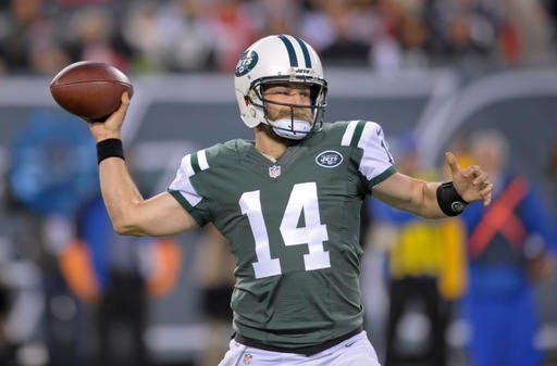 New York Jets quarterback Ryan Fitzpatrick (14) throws against the New England Patriots during the first quarter of an NFL football game, Sunday, Nov. 27, 2016, in East Rutherford, N.J. (AP Photo/Bill Kostroun)