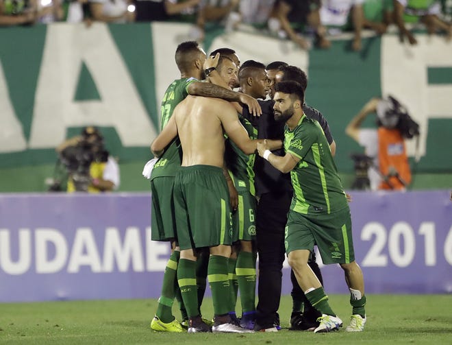 Members of Brazil's Chapecoense celebrate at the end of a Copa Sudamericana semifinal soccer match against Argentina's San Lorenzo last week. A chartered aircraft with 81 people on board, including the Brazilian first division Chapecoense soccer team, crashed on its way to Medellin's international airport late Monday, killing 71. THE ASSOCIATED PRESS