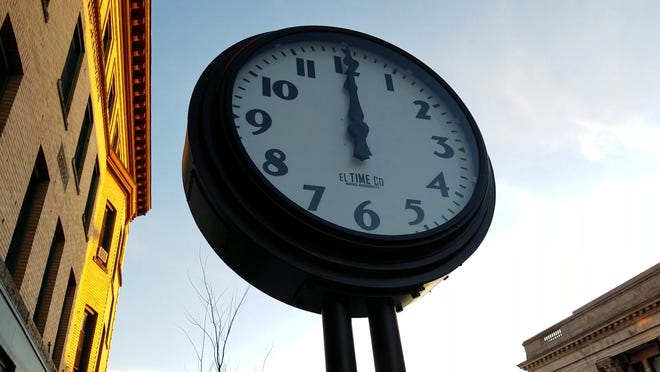 An electric clock that dates to the 1930s was recently reinstalled in front of the Kendall Building in downtown Framingham. Daily News Staff Photo/Jim Haddadin