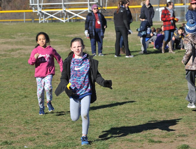 Kennedy School grade 3 students Ciara Sheehan and Allison Pawlowski race to the finish during the school's Turkey Trot on Nov. 23.

Wicked Local photo/Tom Gorman