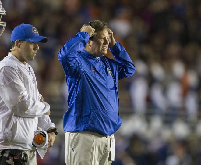 Florida coach Jim McElwain reacts after a player was injured during the first half of the team's NCAA college football game against Florida State in Tallahassee, Fla., Saturday, Nov. 26, 2016. Florida State defeated Florida 33-13. (AP Photo/Mark Wallheiser)