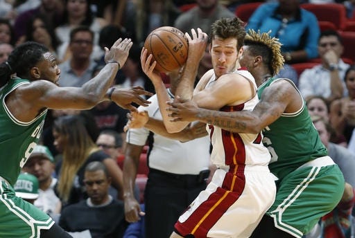 Celtics guard Marcus Smart (right) was unhappy with the way the Heat's Goran Dragic (center) fouled him on Monday's game. AP Photo/Wilfredo Lee