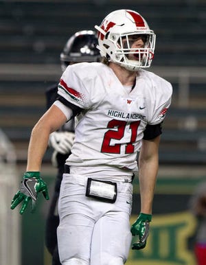 In this Nov. 26, 2016, photo, The Woodlands linebacker Grant Milton (21) celebrates after sacking Austin Bowie quarterback Wade Smith (11) during the second quarter of a Class 6A Division I regional semifinal game in Waco, Texas. School officials say Milton is in intensive care after suffering an injury during a playoff game. Conroe Independent School District spokeswoman Sarah Blakelock said in a statement Monday that Grant Milton was injured during the regional football playoff game Saturday. (Jason Fochtman/Houston Chronicle via AP)