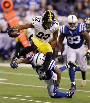 FILE - In this Nov. 24, 2016 file photo, Pittsburgh Steelers' Mike Mitchell (23) jumps over Indianapolis Colts wide receiver Donte Moncrief (10) after making an interception during the second half of an NFL football game in Indianapolis. The Thursday night clash between the Steelers and the Colts was the week’s most-watched show, scoring nearly 21 million viewers. (AP Photo/Michael Conroy, File)