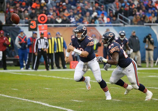 Chicago Bears quarterback Matt Barkley (12) and running back Jordan Howard (24) chase the loose ball during the second half of an NFL football game against the Tennessee Titans, Sunday, Nov. 27, 2016, in Chicago. (AP Photo/Charles Rex Arbogast)