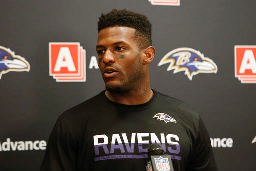 FILE - In this Sept. 18, 2016, file photo, Baltimore Ravens wide receiver Mike Wallace speaks to the media during a news conference after an NFL football game against the Cleveland Browns, in Cleveland. Wallace plays against his former team, the Miami Dolphins, on Sunday. (AP Photo/Ron Schwane, File)