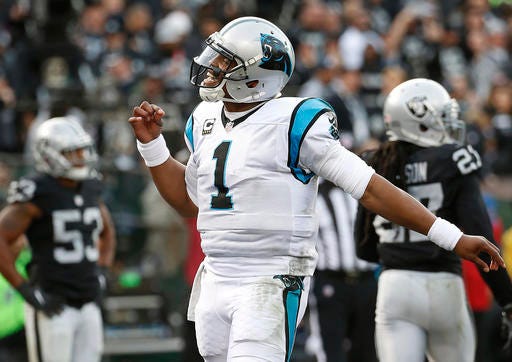 Carolina Panthers quarterback Cam Newton (1) celebrates after Jonathan Stewart scored a touchdown against the Oakland Raiders during the second half of an NFL football game in Oakland, Calif., Sunday, Nov. 27, 2016. (AP Photo/Tony Avelar)