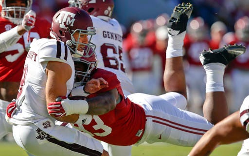 FILE - In this Oct. 22, 2016, file photo, Alabama defensive lineman Jonathan Allen (93) sacks Texas A&M quarterback Trevor Knight during the first half of an NCAA college football game,in Tuscaloosa, Ala. The Southeastern Conference's two stingiest defenses will take the field in the league championship game. (AP Photo/Brynn Anderson, File)