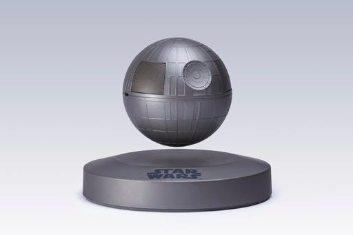 This photo provided by Plox shows the "Star Wars" Death Star levitating bluetooth speaker. It’s a little tricky to set up, but once you get the Death Star positioned correctly over its base, it floats in the air thanks to well-placed magnets and a little help from “The Force.” The Death Star rotates with a tap. The sound quality is pretty good, and the rechargeable battery will give you five hours of sound. (Courtesy of Plox via AP)