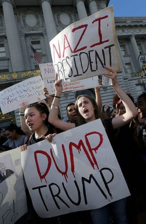 Mission High School student Hope Robertson, right, yells as she protests with other high school students in opposition of Donald Trump's presidential election victory in front of City Hall in San Francisco on Nov. 10, 2016.