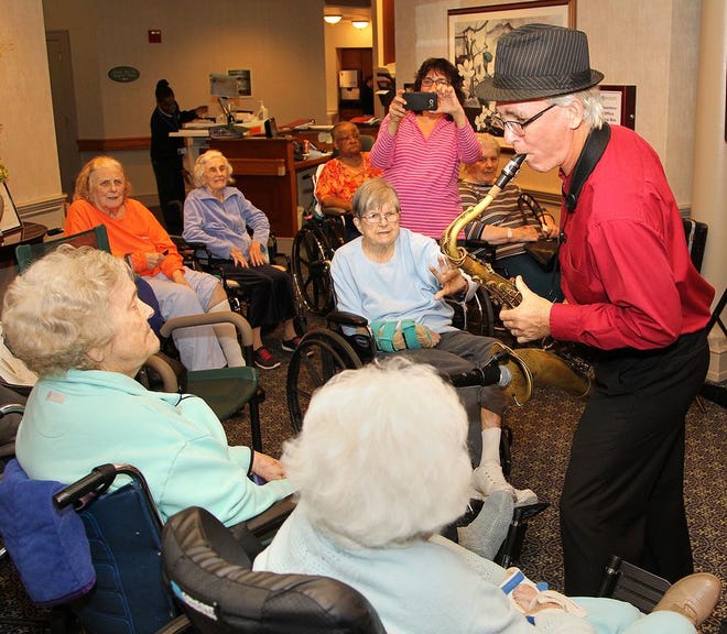 Dave Becker entertains with his saxophone at Marina Bay Skilled Nursing and Rehab. Center and The Atria at Marina Place's annual Harvest Festival, Saturday, Oct. 1, 2016.
G
