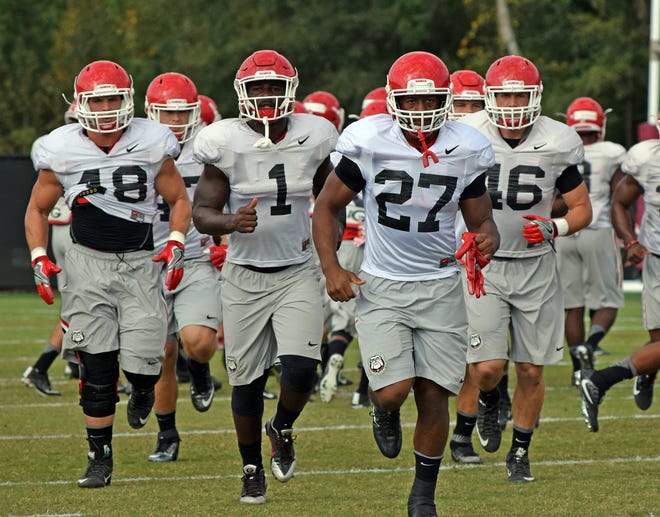 Georgia tailbacks Nick Chubb (27) and Sony Michel (1) during the Bulldogs’ practice in Athens, Ga., on Monday, Oct. 3, 2016. (Photo by Steven Colquitt)