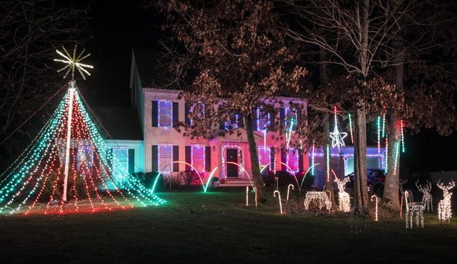 Luke Dobson's Christmas light show continues at his family's house on Overlook Drive in Dover. The family is collecting nonperishable food for the St. Joseph's food pantry. John Huff/Fosters.com