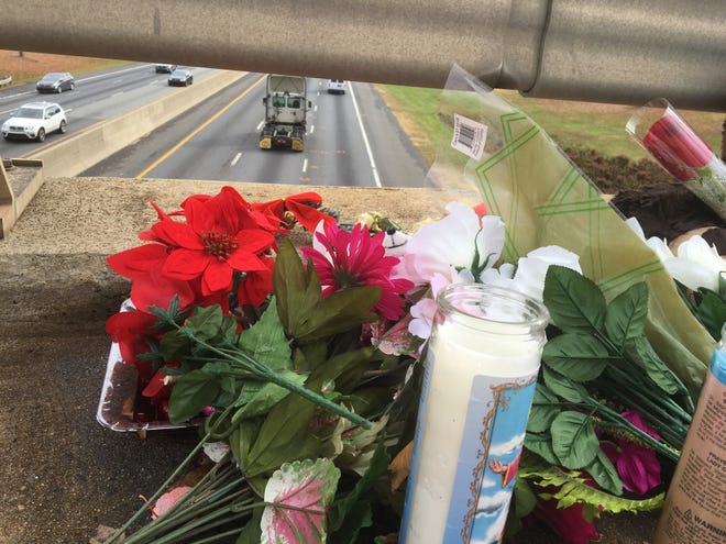 A memorial of candles, stuffed animals and flowers has been made on the Cox Road bridge over Interstate 85 in Gastonia, where a 16-year-old woman jumped to her death last week. ERIC WILDSTEIN/THE GAZETTE