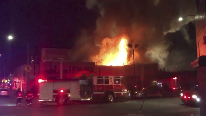 This photo taken from video provided by @Oaklandfirelive shows the scene of a fire in Oakland, early Saturday, Dec. 3, 2016.  The blaze began at about 11:30 p.m. on Friday during a party at a warehouse in the San Francisco Bay Area city. Several people were unaccounted for.  Oakland Fire Department posted several messages throughout the night on its Twitter social media network account, including the latest one in the morning saying that fire crews would remain on the scene for several more hours to extinguish hot spots(@Oaklandfirelive via AP)