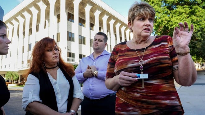 Peggy Hernandez talks to the media outside the federal courthouse after the sentencing of Christopher Massena, who sold the fatal dose of fentanyl that killed her son Christian “Ty” Hernandez in February 2016. She spoke in downtown West Palm Beach on Dec. 2, 2016, after Massena was sentenced to 30 years in federal prison. Also pictured left to right are Christian’s sister Kristin Rollins, aunt Gigi Jimenez, and brother Chris Hernandez. (Richard Graulich / The Palm Beach Post)