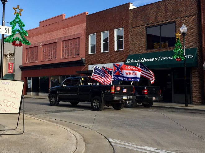 A truck drives through downtown Roxboro during a KKK "Trump victory parade" on Saturday.