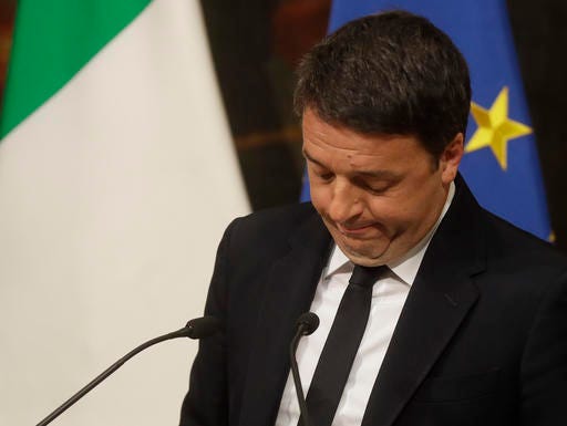 Italian Premier Matteo Renzi speaks during a press conference at the premier's office Chigi Palace in Rome, early Monday, Dec. 5, 2016. Renzi acknowledged defeat in a constitutional referendum and announced he would resign on Monday. Italians voted Sunday in a referendum on constitutional reforms that Premier Matteo Renzi has staked his political future on. (AP Photo/Gregorio Borgia)