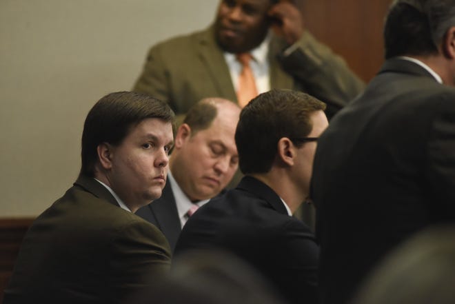 Justin Ross Harris sits with his defense team in the Glynn County Courthouse in Brunswick, Ga., on Nov. 14. Harris, whose toddler son died after being left for hours in a hot car, was convicted of murder by a jury that concluded a month's worth of trial testimony and evidence showed the father left his child to perish on purpose. (File/John Carrington/Atlanta Journal-Constitution via AP)