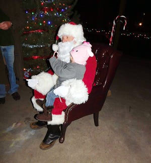 Santa Claus was on hand for Christmas at Myers Park Sunday evening and took time to meet with the children. TIMES TELEGRAM PHOTO/DONNA THOMPSON