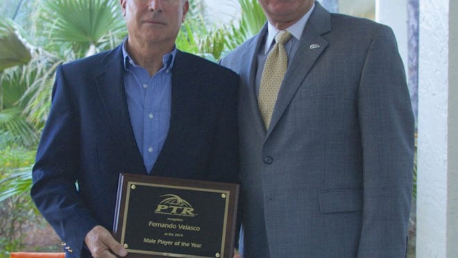 Fernando Velasco, owner of Grey Rock Tennis Club, poses with Jorge Andrew, president of the Professional Tennis Registry.