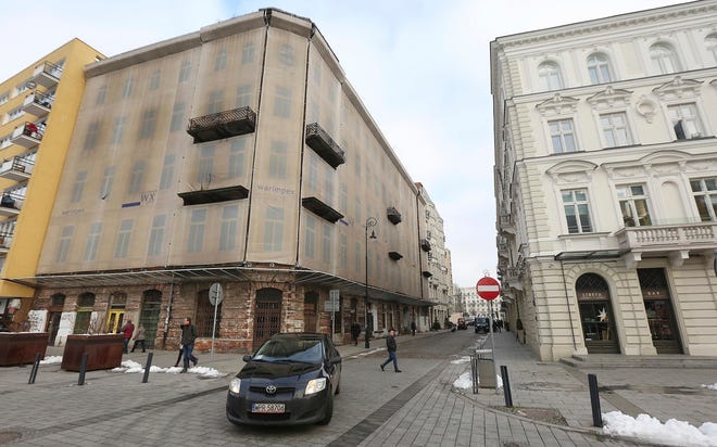 This Dec. 5, 2016, image shows Prozna Street, in the heart of what was Warsaw’s Jewish quarter before World War II, in Warsaw, Poland. The World Jewish Restitution Organization, a group that helps Holocaust survivors claim lost prewar properties, launched a database aimed at helping more than 2,000 Holocaust survivors or their heirs regain property lost in Warsaw due to World War II and communism. (AP Photo/Czarek Sokolowski)