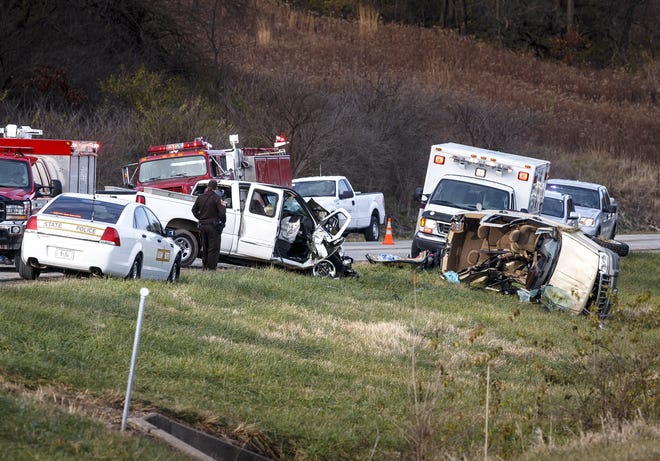 Emergency personnel work at a fatal two-vehicle crash involving a pickup truck and a Jeep on Illinois 97 just north of North Shore Road, Tuesday, Dec. 6, 2016, near Petersburg. Justin L. Fowler/The State Journal-Register