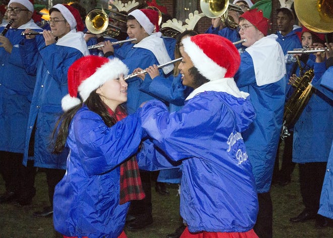 Randolph High School Marching Band members Annabel Chu and Kenna Chardonnette, both sophomores, dance to festive holiday tunes.

Wicked Local photo/Bob Michelson