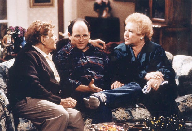 Jason Alexander sits between Jerry Stiller and Estelle Harris, who play his parents.