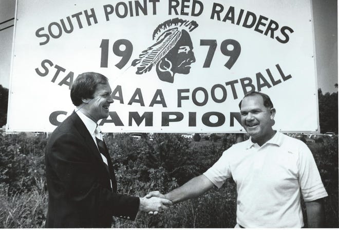 Belmont mayor Billy Joye (left) and South Point High football coach Jim Biggerstaff during a ceremony honoring the Red Raiders' 1979 N.C. 3A championship team. (Gazette file photo)