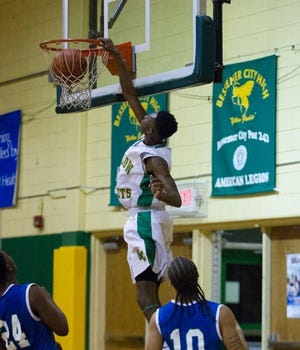 Trel Mclean dunks during a game last season against Mountain Island Charter. The senior had 34 points against South Point Wednesday night. Brian Mayhew / Special to the Gazette