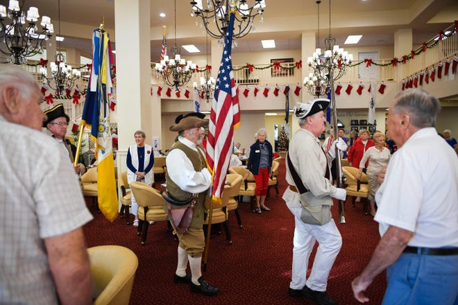The Saramana Chapter of the Sons of the American Revolution serve as color guard at the Remembering Pearl Harbor Day event Wednesday in Lakewood Ranch. All veterans who attended were honored with a medal and an "All-American Meal." HERALD-TRIBUNE STAFF PHOTO / RACHEL S. O'HARA