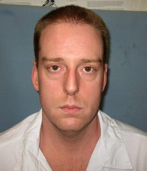 FILE - This undated photo provided by the Alabama Department of Corrections shows Ronald Bert Smith Jr.. Smith, who is scheduled to be executed Thursday, Dec. 8, 2016 for the 1994 slaying of Huntsville store clerk Casey Wilson, is asking the governor to stop his execution because a judge imposed a death sentence over the jury’s 7-5 recommendation of life imprisonment. (Alabama Department of Corrections via AP, File)