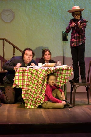 Dad and Mom (Jefferson C. Post and Allison Collins), with Randy (under the table) and Ralphie, in the stage adaptation of the comic holiday classic "A Christmas Story." COURTESY PHOTO