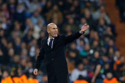 Real Madrid's head coach Zinedine Zidane signals during the Champions League, Group F, soccer match between Real Madrid and Borrusia Dortmund at the Santiago Bernabeu stadium in Madrid, Spain, Wednesday, Dec. 7, 2016. (AP Photo/Francisco Seco)