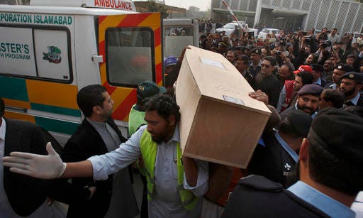 Pakistani rescue workers and volunteers unload a casket carrying the body of a plane crash victim at a local hospital in Islamabad, Pakistan, Thursday, Dec. 8, 2016. Pakistani military helicopters ferried the remains of plane crash victims to the capital, Islamabad, as aviation authorities said they opened a probe into the crash that killed 47 passengers and crew the day before in the country's northwest. (AP Photo/Anjum Naveed)