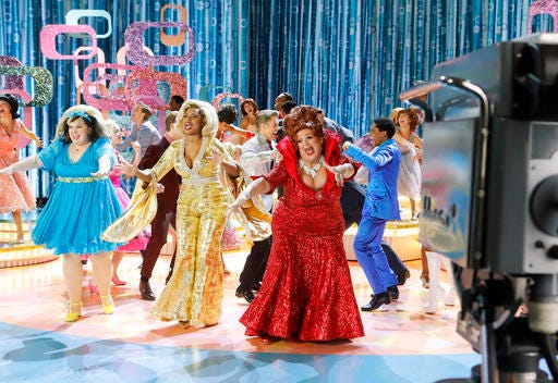 This image released by NBC shows, from left, Maddie Baillio as Tracy Turnblad, Jennifer Hudson as Motormouth Maybelle, Harvey Fierstein as Edna Turnblad during a rehearsal for "Hairspray Live!," airing Dec. 7. Sets for the musical were designed by Broadway set designer Derek McLane. (Trae Patton/NBC via AP)