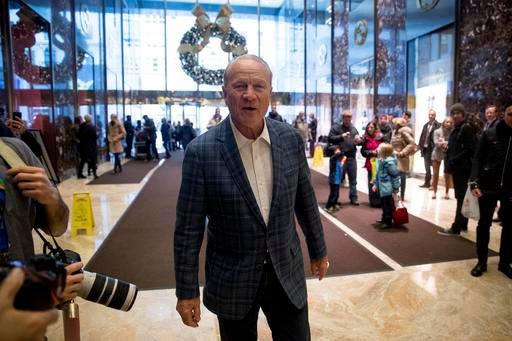 Former football player and coach Barry Switzer speaks to members of the media in the lobby of Trump Tower in New York, Wednesday, Dec. 7, 2016. (AP Photo/Andrew Harnik)