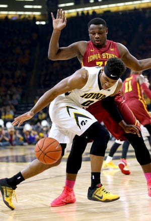 Iowa forward Ahmad Wagner loses control of the ball as he tries to dribble past Iowa State guard Deonte Burton during the first half of an NCAA college basketball game, Thursday, Dec. 8, 2016, in Iowa City, Iowa. (AP Photo/Justin Hayworth)