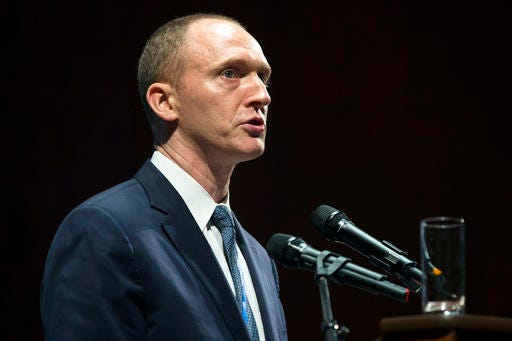 FILE - In this Friday, July 8, 2016, file photo, Carter Page, then adviser to U.S. Republican presidential candidate Donald Trump, speaks at the graduation ceremony for the New Economic School in Moscow, Russia. Russian state-owned news agency RIA Novosti says Thursday, Dec. 8, 2016, that Page is visiting Moscow to meet businessmen and politicians. (AP Photo/Pavel Golovkin, File)