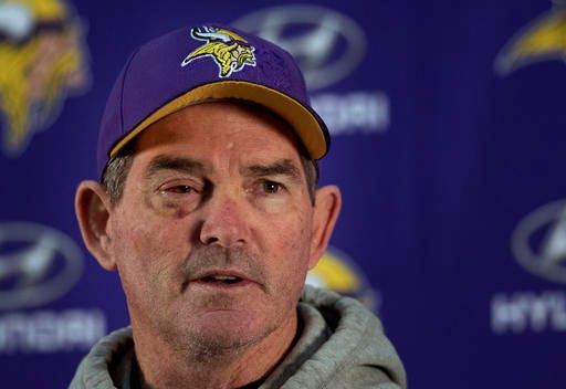 Vikings head coach Mike Zimmer spoke during a news conference at Winter Park, Wednesday, Dec. 7, 2016 in Eden Prairie, Minn. Zimmer has received further clearance to travel with the team this weekend, following surgery to repair a detached retina. (Jerry Holt/Star Tribune via AP)