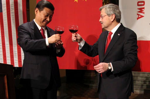 FILE - In this Feb. 15, 2012 file-pool photo, Chinese Vice President Xi Jinping and Iowa Gov. Terry Branstad raise their glasses at the beginning of a formal dinner in the rotunda at the Iowa Statehouse in Des Moines, Iowa. Branstad, President-elect Donald Trump's choice for U.S. ambassador to China, can boast a 30-year relationship with Chinese President Xi Jinping, the most powerful Chinese leader in decades, especially amid escalating talk of a trade war with the U.S.’s largest trading partner? (AP Photo/The Des Moines Register, Andrea Melendez, Pool, File)