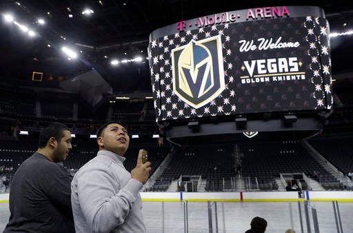 FILE - In this Nov. 22, 2016, file photo, people tour T-Mobile Arena during an event to unveil the name of Las Vegas' National Hockey League franchise, in Las Vegas. The U.S. Patent and Trademark Office has denied the Vegas Golden Knights’ trademark application a little more than two weeks after the new NHL franchise unveiled its name and logo.
The office cites potential confusion with the team name for the College of Saint Rose in New York, which is also the Golden Knights. (AP Photo/John Locher, File)