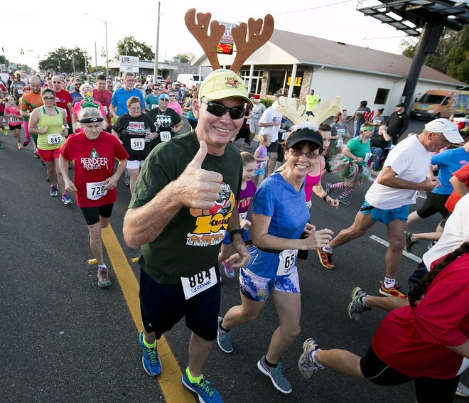 Hundreds of runners and walkers will saturate East Silver Springs Boulevard Saturday for the Reindeer Run. The popular annual event precedes the Ocala Christmas Parade. (Doug Engle/Ocala Star-Banner)2015.