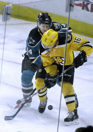 Worcester's Taylor Fedun (14) tries to get the puck from Wayne Simpson of Providence in January 2015. Simpson played four games with Providence in 2014-15 before returning to the ECHL.
