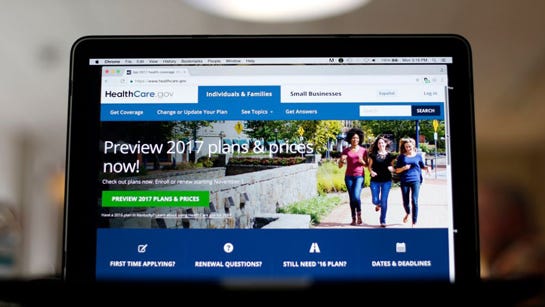 FILE - This Oct. 24, 2016, file photo, shows the HealthCare.gov 2017 website home page on display, in Washington. Health insurance experts say the decision to buy 2017 coverage on the Affordable Care Act's public exchanges shouldn't boil down to a gamble over the survival of the law, which requires most people to have insurance. Instead, customers should focus on whether they can handle the financial risk that comes with remaining uninsured while they wait for Trump's health care plan to crystallize. (AP Photo/Pablo Martinez Monsivais, File)