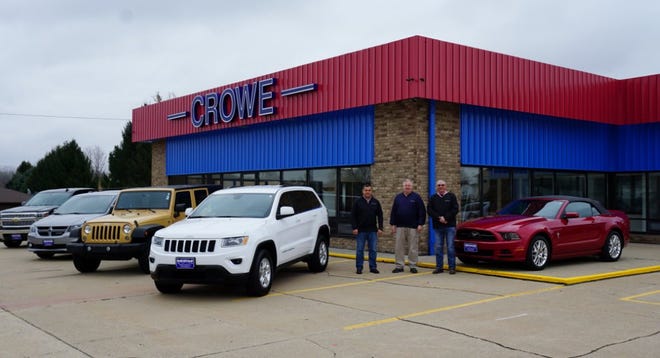Crowe is opening a used car dealership at the former Maple Leaf Motors site (west of Geneseo on Route 6). Pictured are, from left, manager Joe Perez and owners Pat Boone and George Koustas.