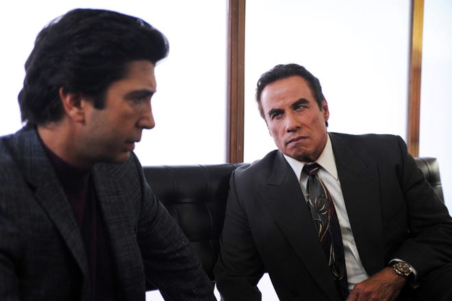 David Schwimmer, left, appears in a scene with John Travolta in "The People v. O.J. Simpson." Schwimmer and Travolta were nominated for outstanding supporting actors. (Ray Mickshaw/FX via AP)